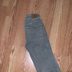 American Eagle green skinny jeans